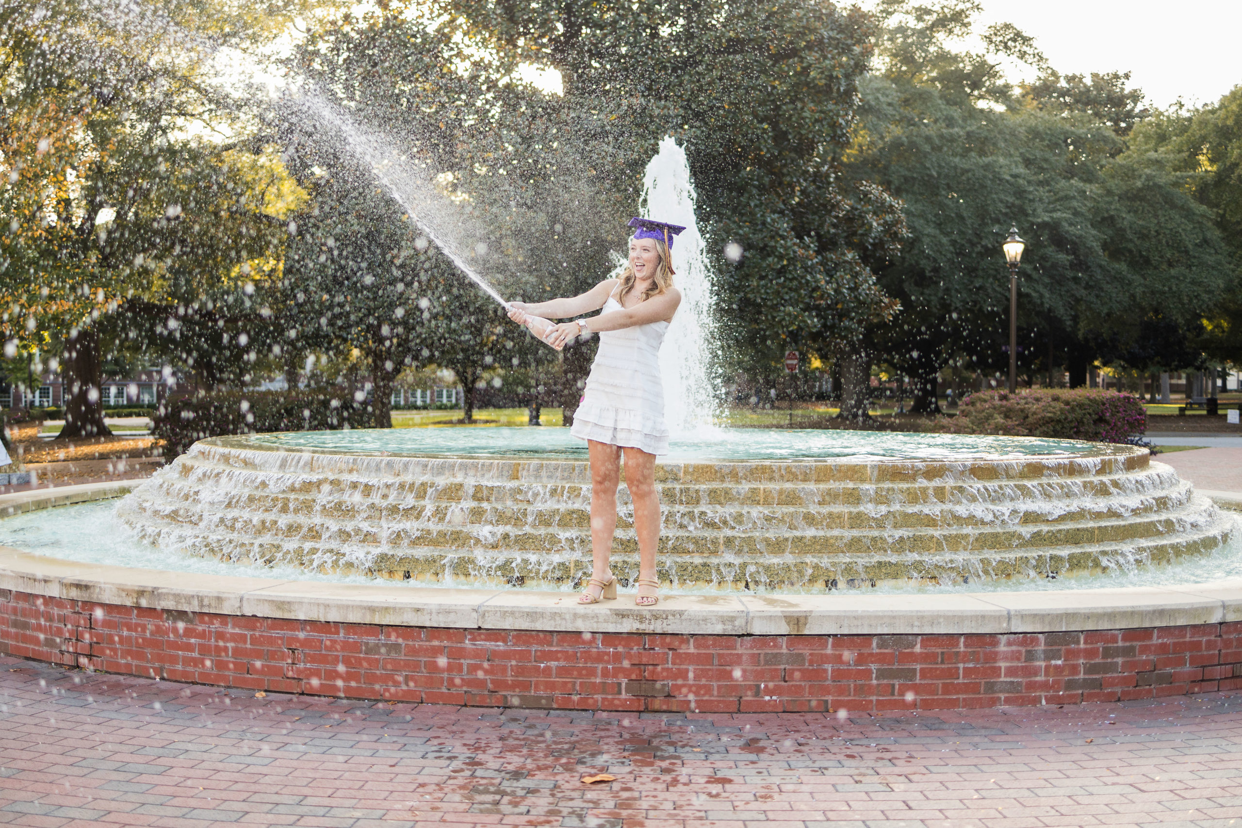 Sarah Hilts photography, senior photographer , nc senior photographer , east Carolina graduation , ECU cap & gown session , Graduation ECU , Cap & gown session, graduation day , Purple and gold , ECU pirates. 