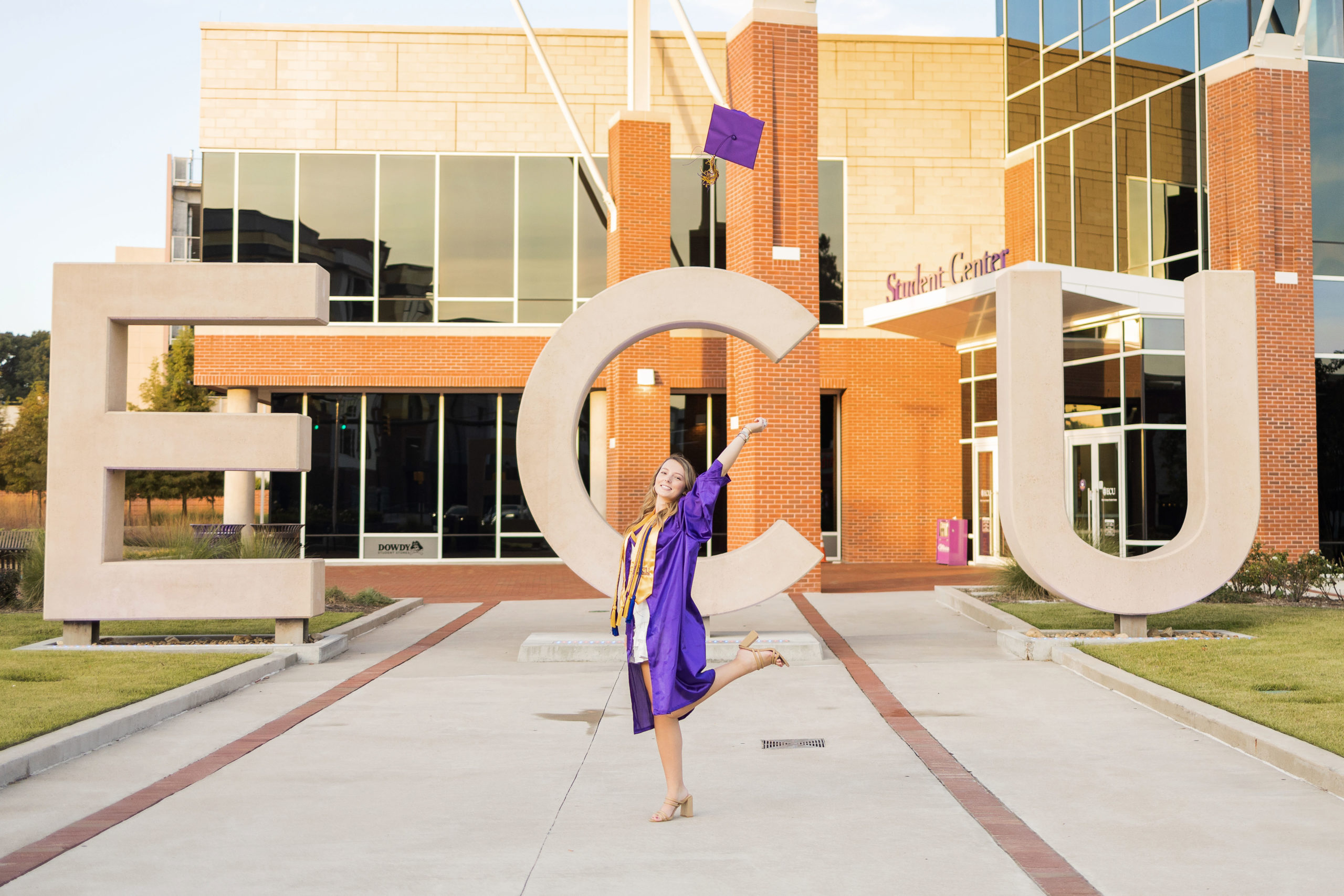 Sarah Hilts photography, senior photographer , nc senior photographer , east Carolina graduation , ECU cap & gown session , Graduation ECU , Cap & gown session, graduation day , Purple and gold , ECU pirates. 