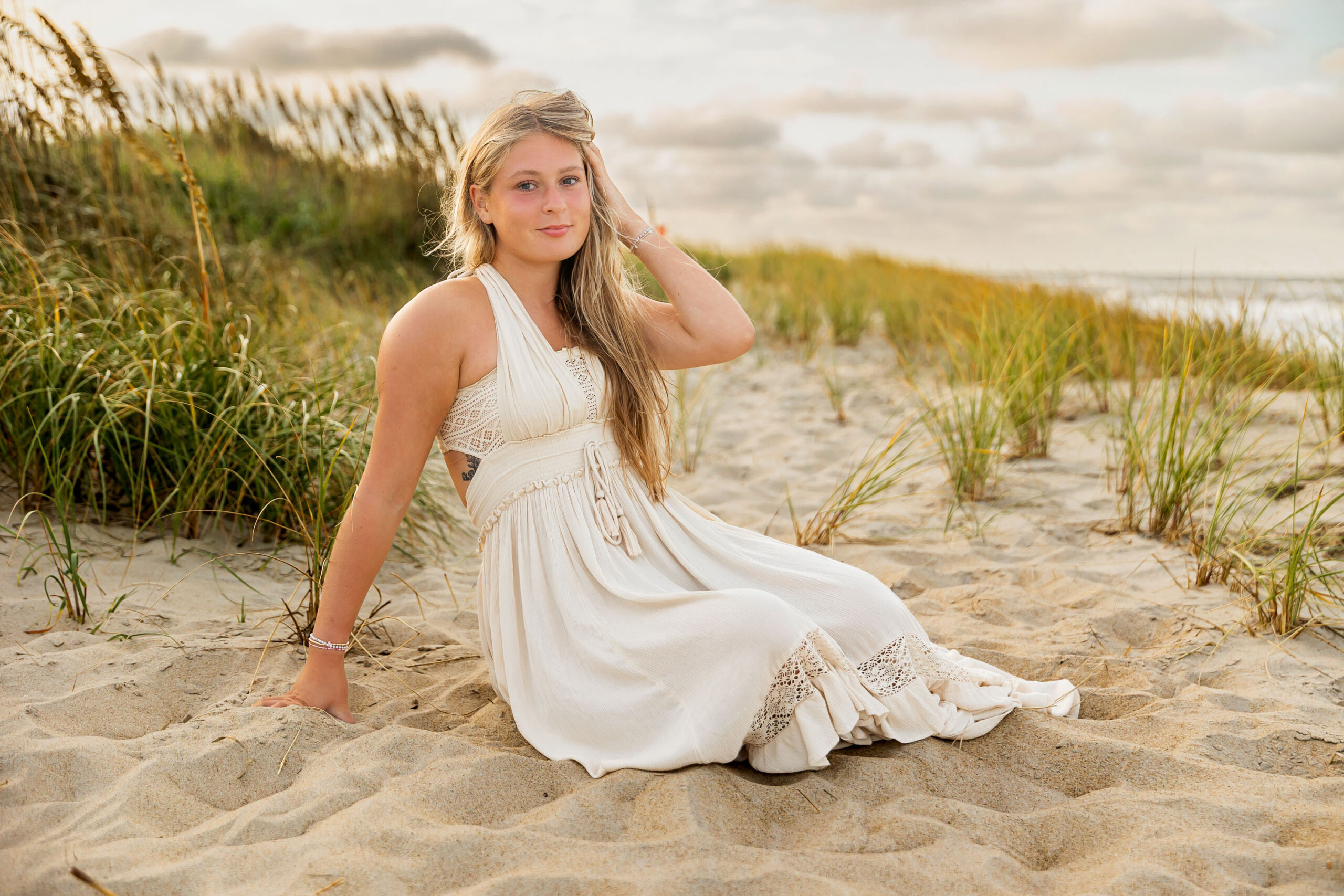 Senior girl beach photos in the Outer Banks with ocean waves