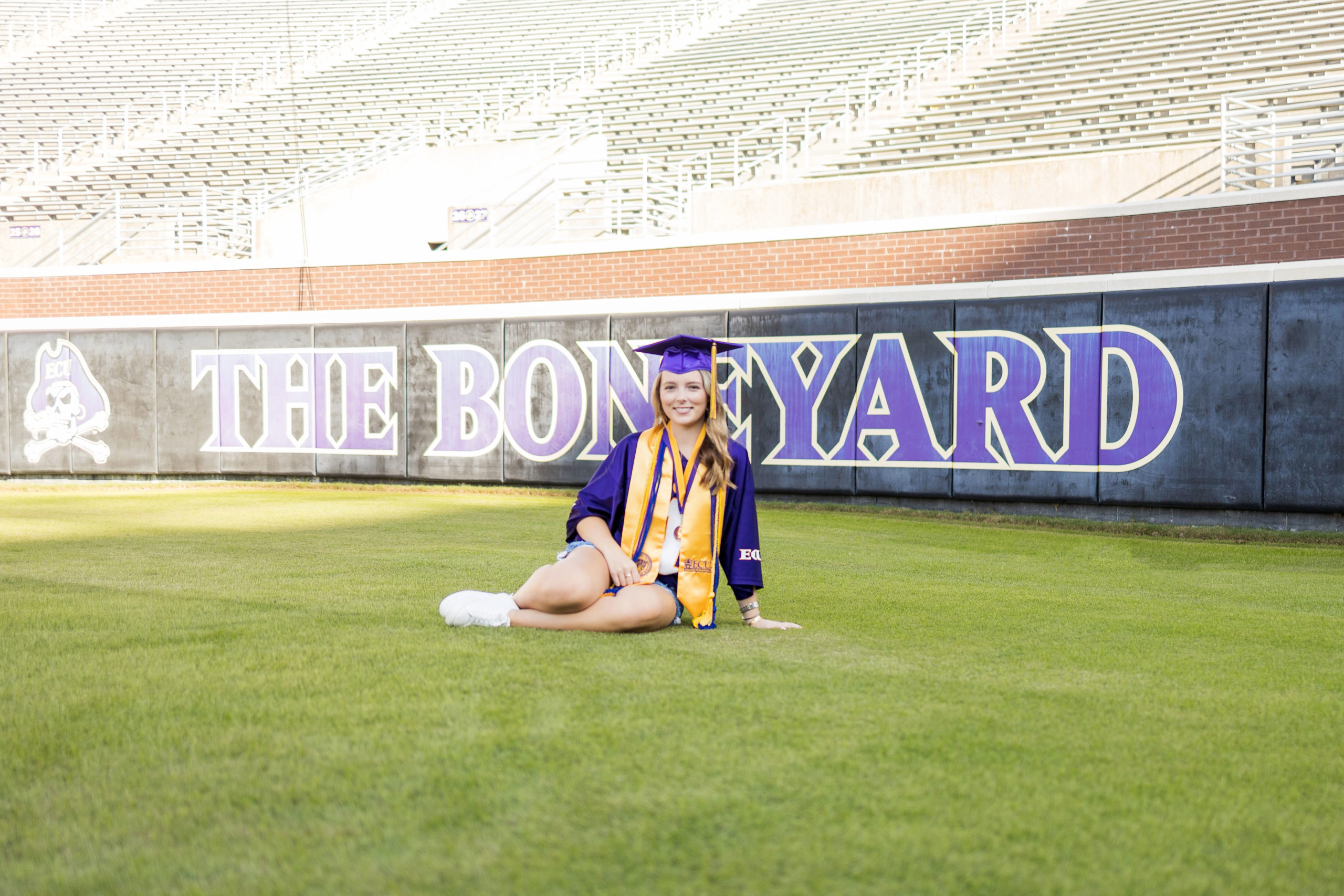 Sarah Hilts photography, senior photographer , nc senior photographer , east Carolina graduation , ECU cap & gown session , Graduation ECU , Cap & gown session, graduation day , Purple and gold , ECU pirates. 