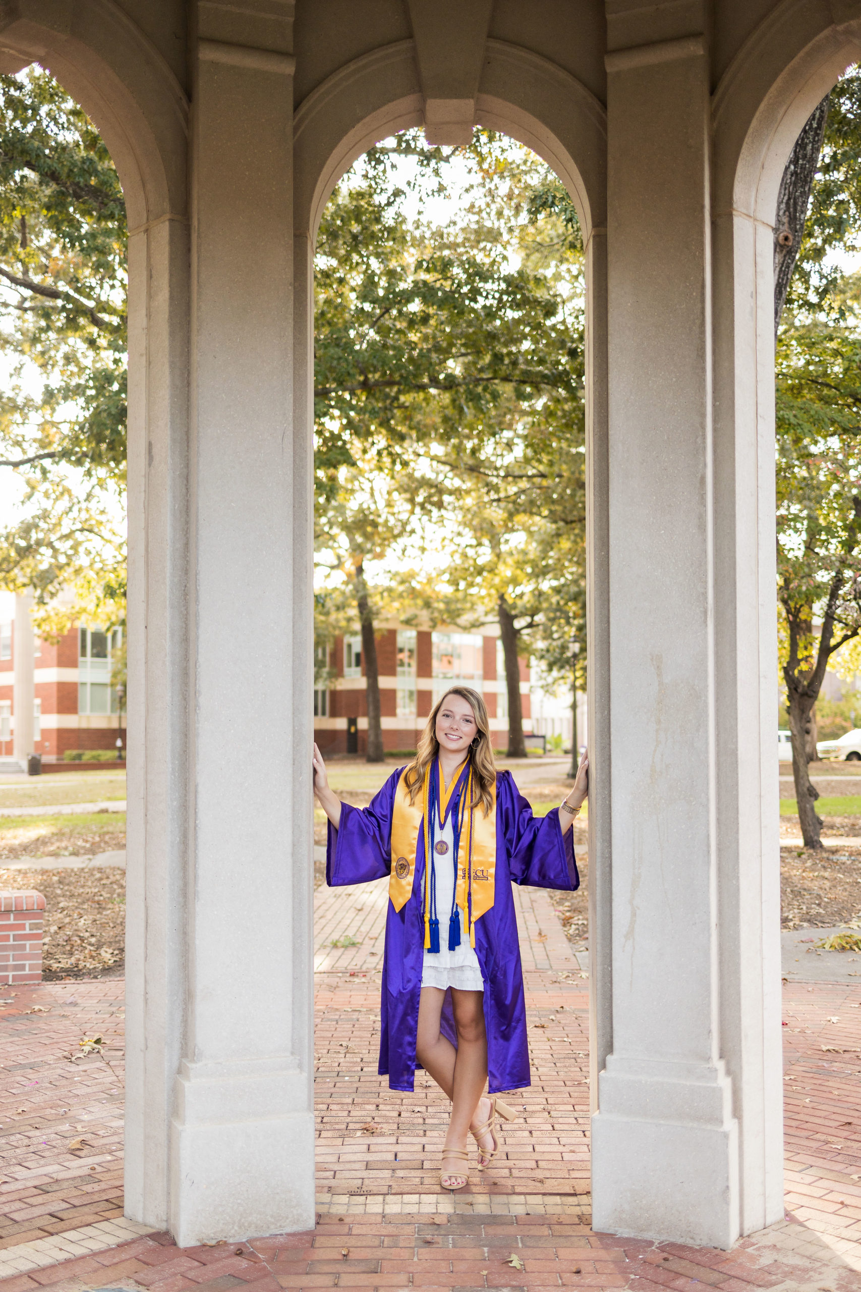 Sarah Hilts photography, senior photographer , nc senior photographer , east Carolina graduation , ECU cap & gown session , Graduation ECU , Cap & gown session, graduation day , Purple and gold , ECU pirates.