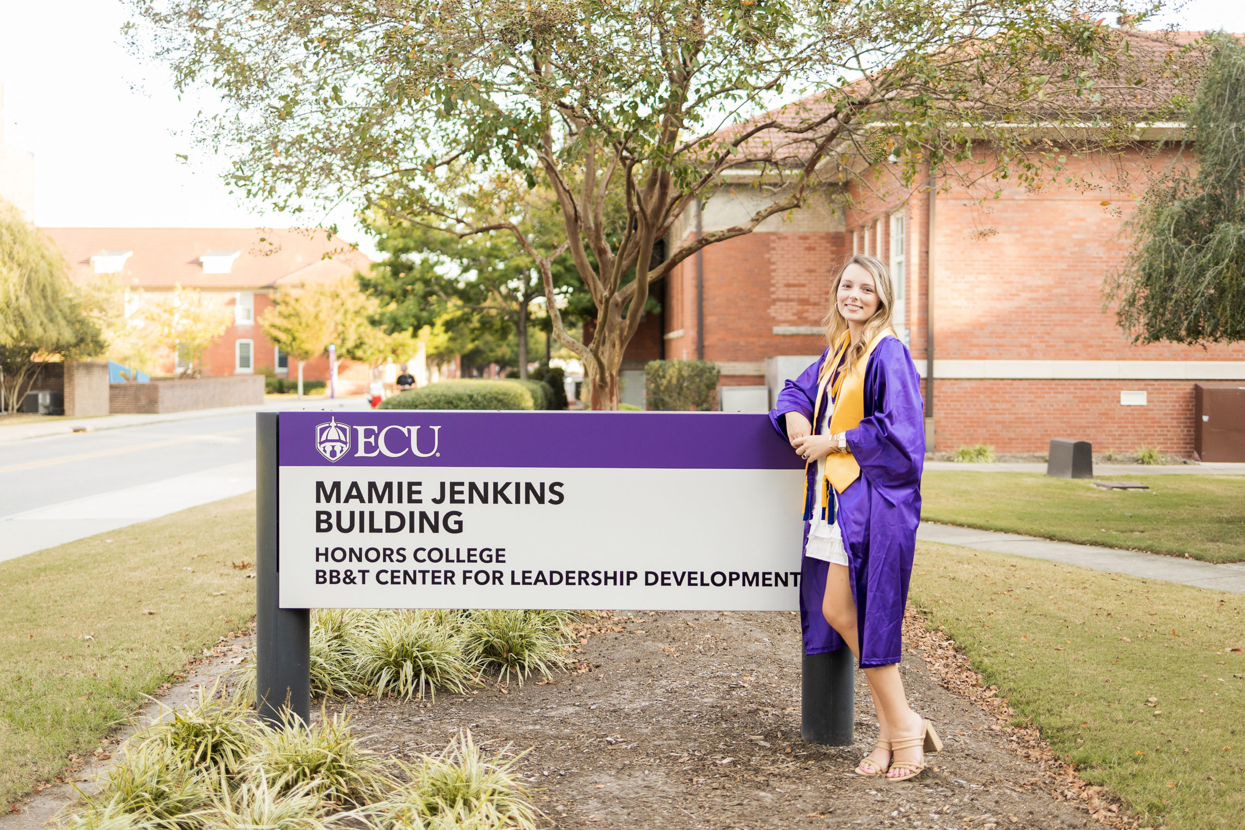 Sarah Hilts photography, senior photographer , nc senior photographer , east Carolina graduation , ECU cap & gown session , Graduation ECU , Cap & gown session, graduation day , Purple and gold , ECU pirates. 